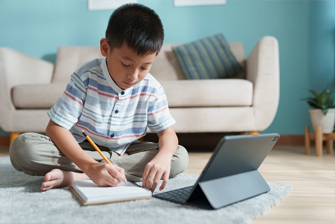 Boy learning on his own