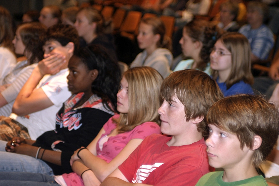 Students watching the performance